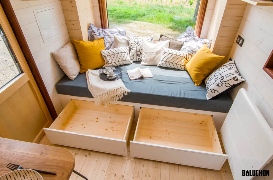 The Piccola Casa's sofa contains some integrated storage space