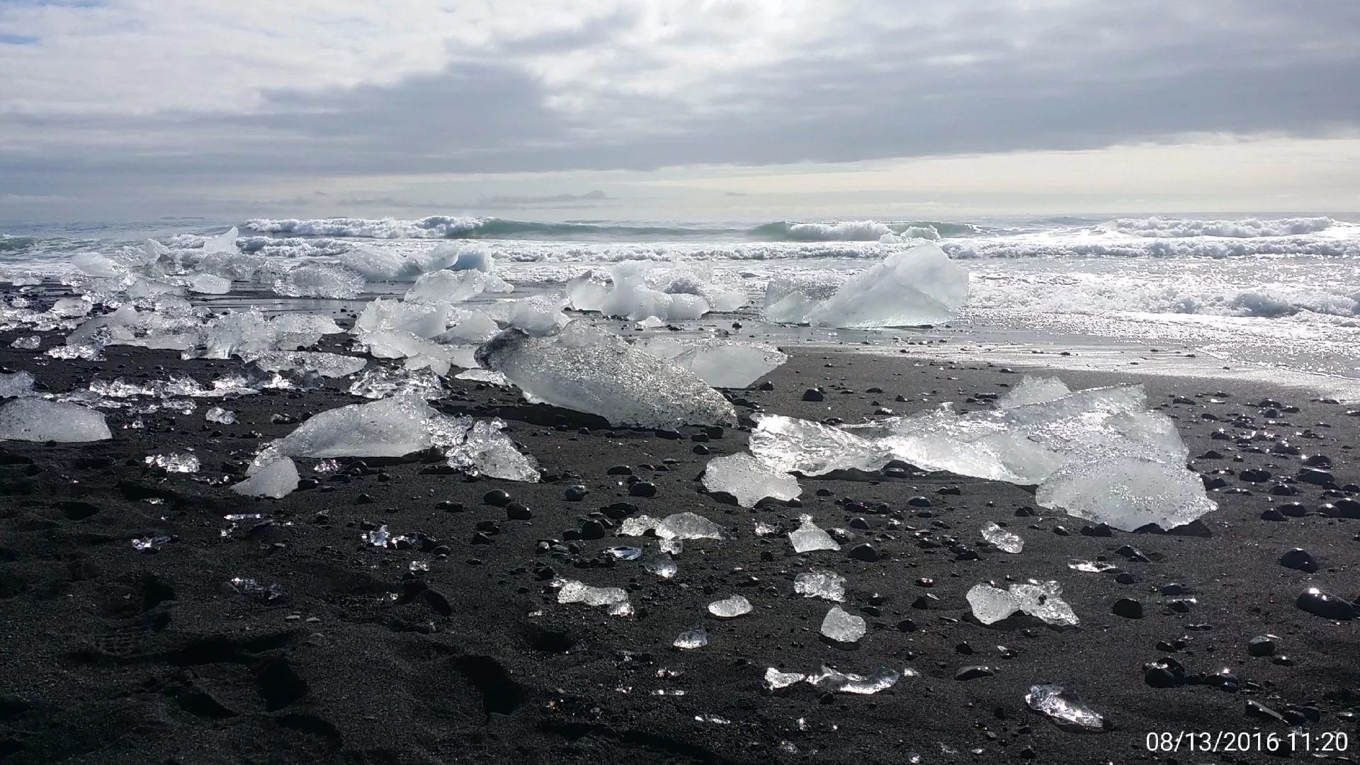 The lagoon is fed by the glacier, and empties out into the North Atlantic ocean where a black-sand beach created from the powdering of volcanic rock receives a regular barrage of ice chunks.