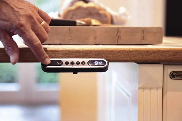 Users can adjust the height of a kitchen unit by simply pressing up or down Baselift system buttons