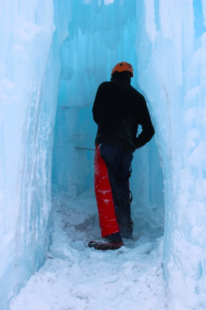 Using a chainsaw to create a room within the Edmonton Ice Castle