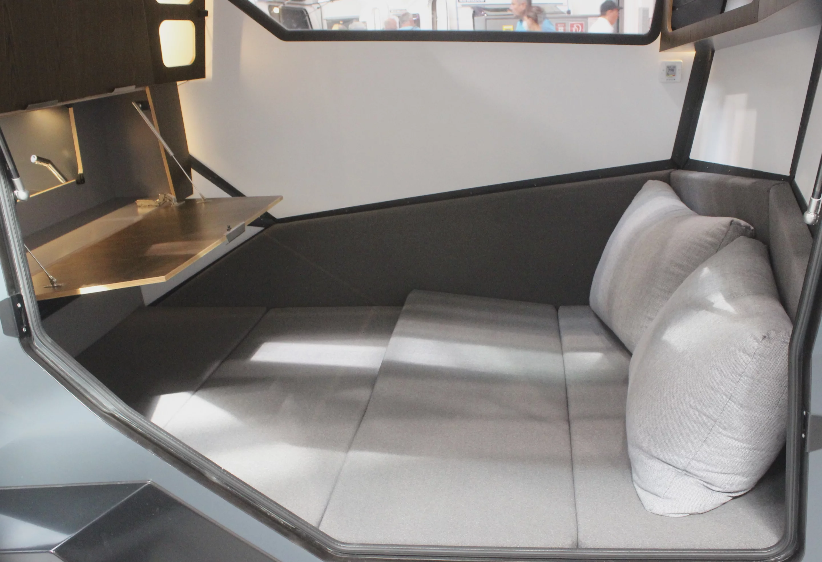 The fold-down pass-through hatch doubles as a table/desk