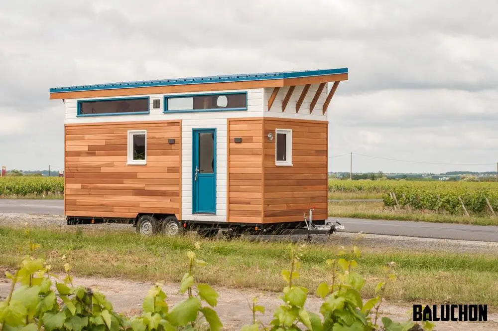 The Valhalla is finished in red cedar with white accenting and topped by a teal roof