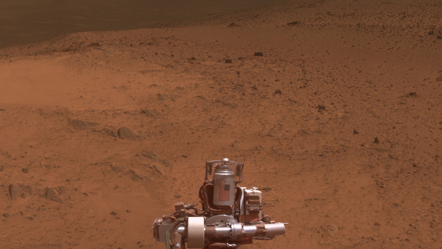 Opportunity's aluminum casing for its rock abrasion tool, emblazoned with the American flag in remembrance of the 9/11 attacks (Photo: NASA/JPL-Caltech/Cornell Univ./Arizona State University)