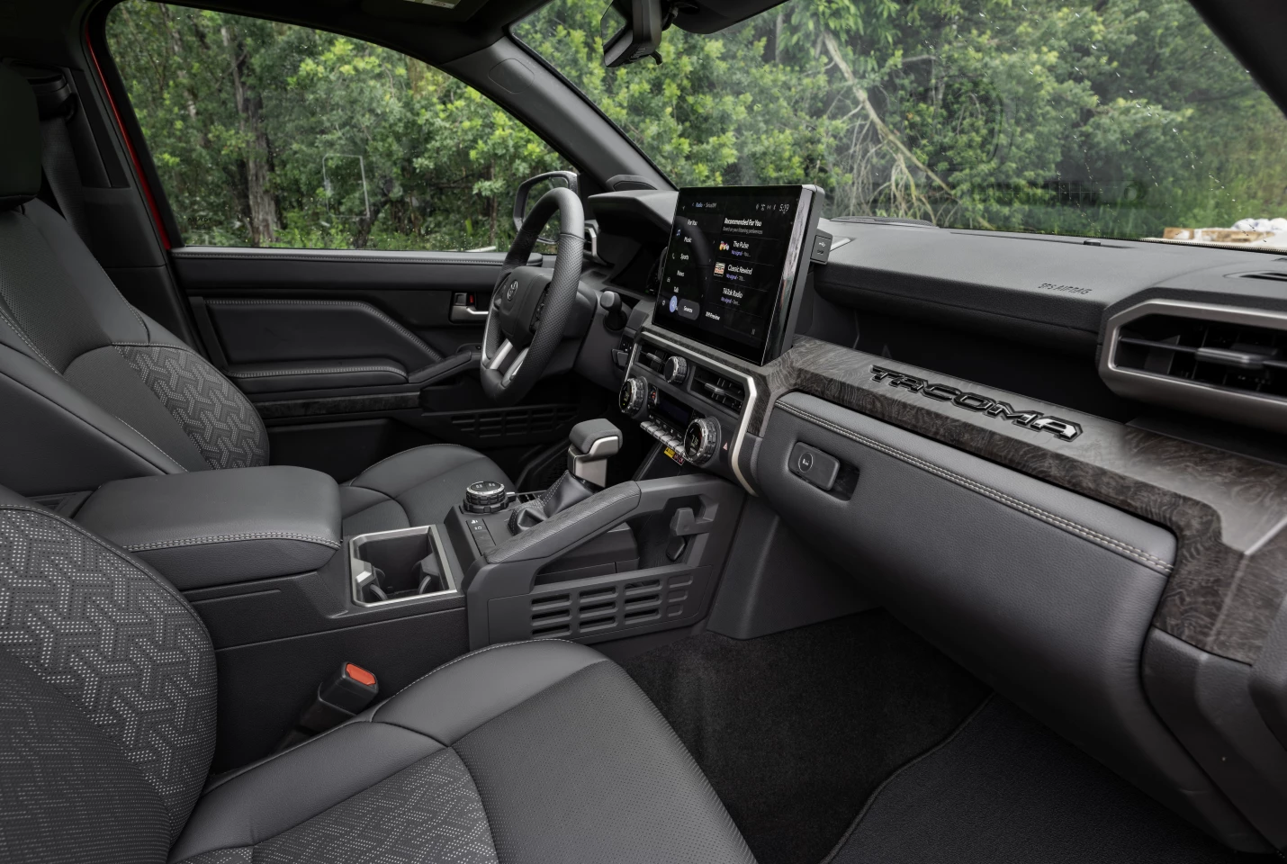 Small features such as an integrated bag hook on the newly-located grab bar are found throughout the Tacoma