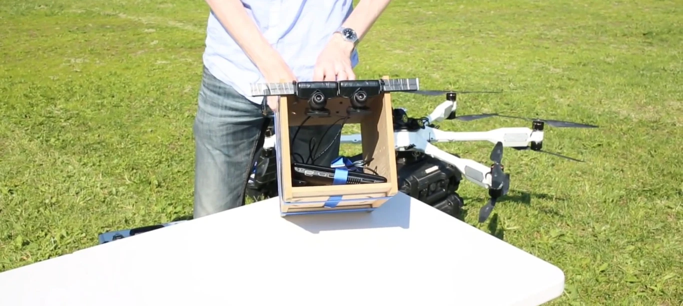 Intuitive Aerial outfitted one of its own Black Armored Drones with a makeshift wooden rig, carrying a laptop and two cameras arranged side-by-side