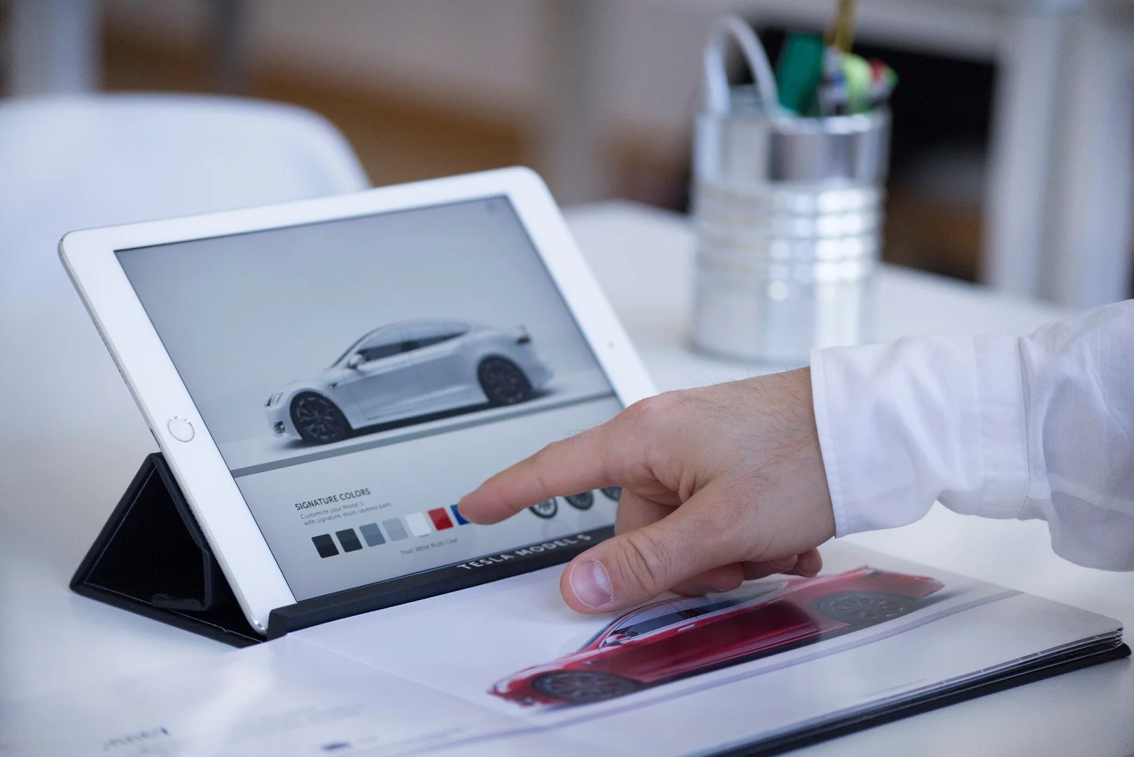 A page in the physical catalog could launch a company's online portal, allowing customers to find out more about a product and make purchases