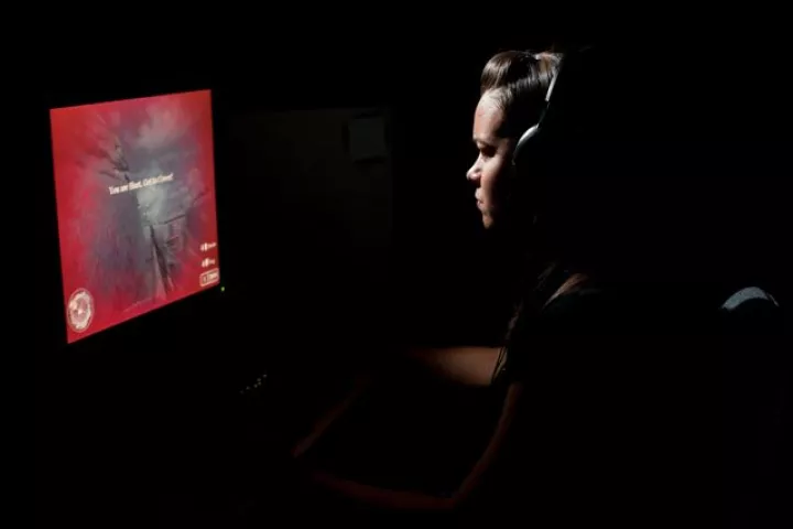 One of the test subjects playing an action video game (Photo: J. Adam Fenster, University of Rochester)