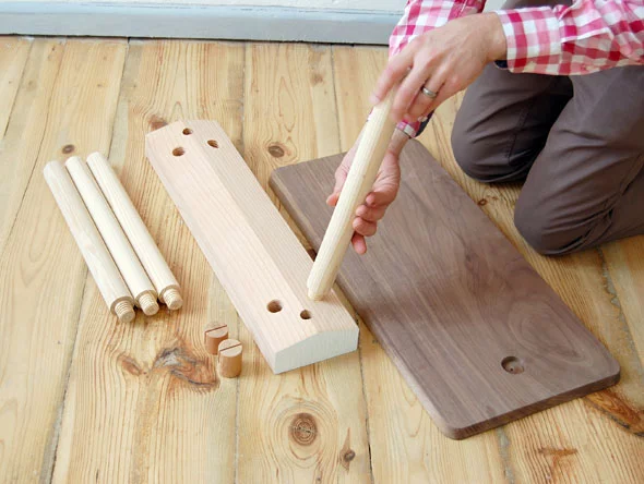 Building the Wood Peg furniture involves simply screwing the legs into place