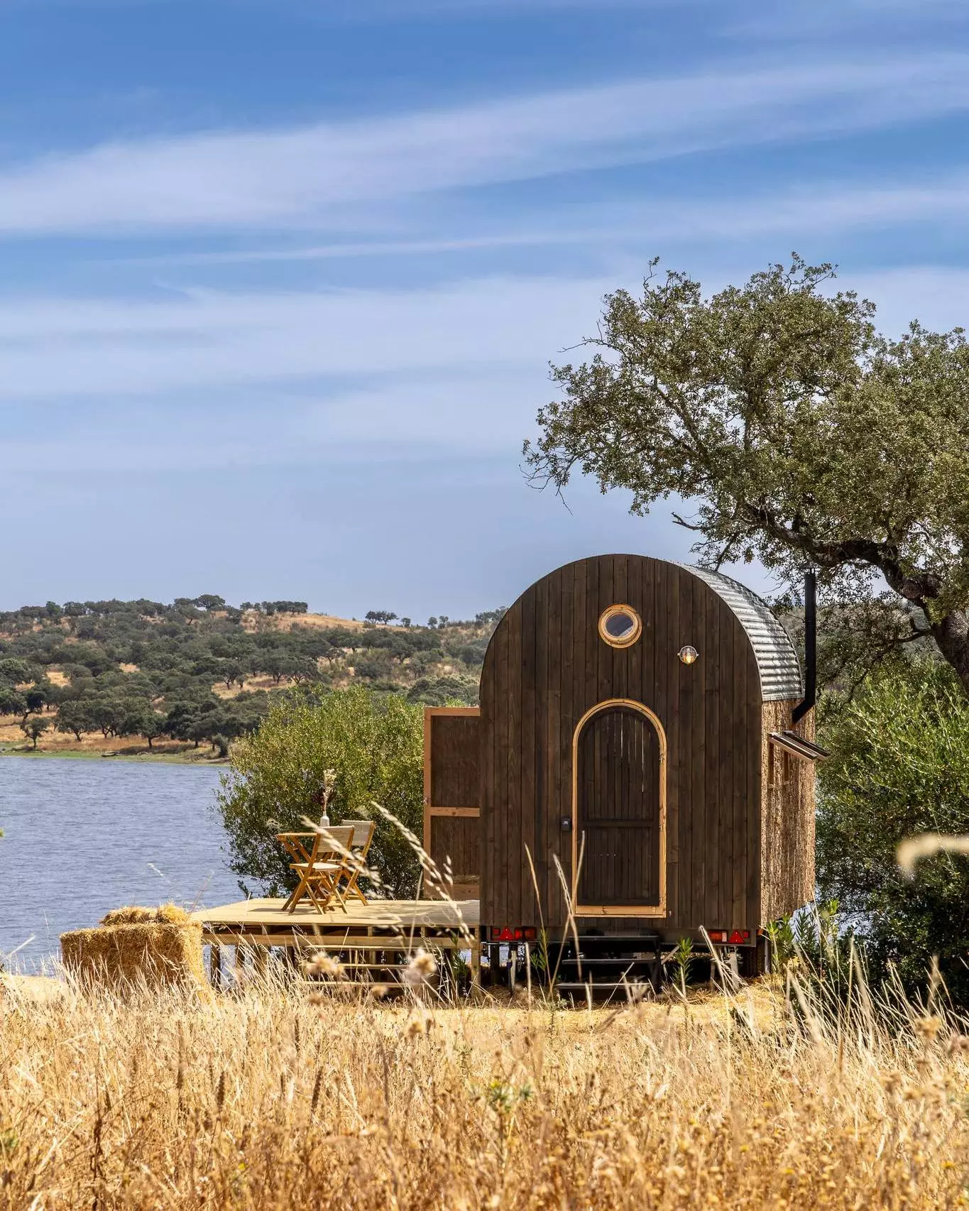 The Terra m1_Tiny House on Wheels is situated on a rural plot in Portugal's Alentejo area
