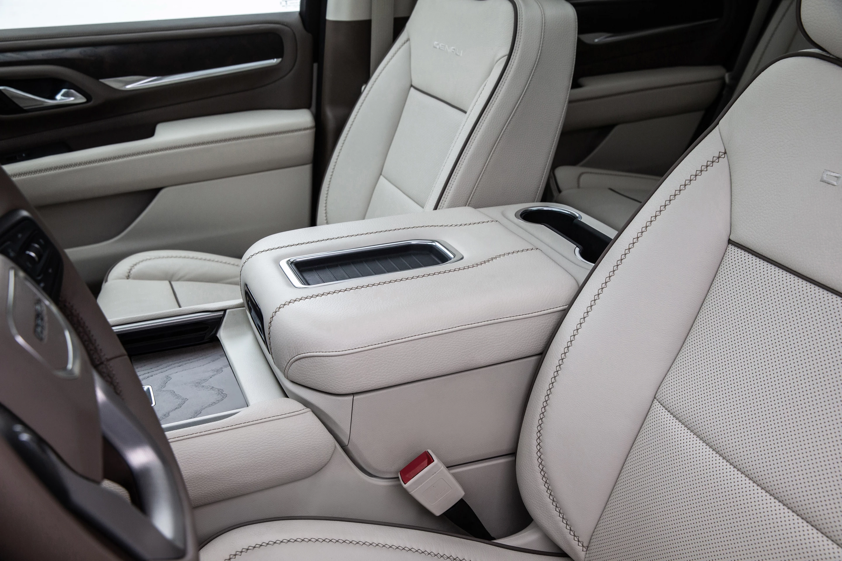 A new power sliding center console bin is an interesting feature in the 2021 Yukon