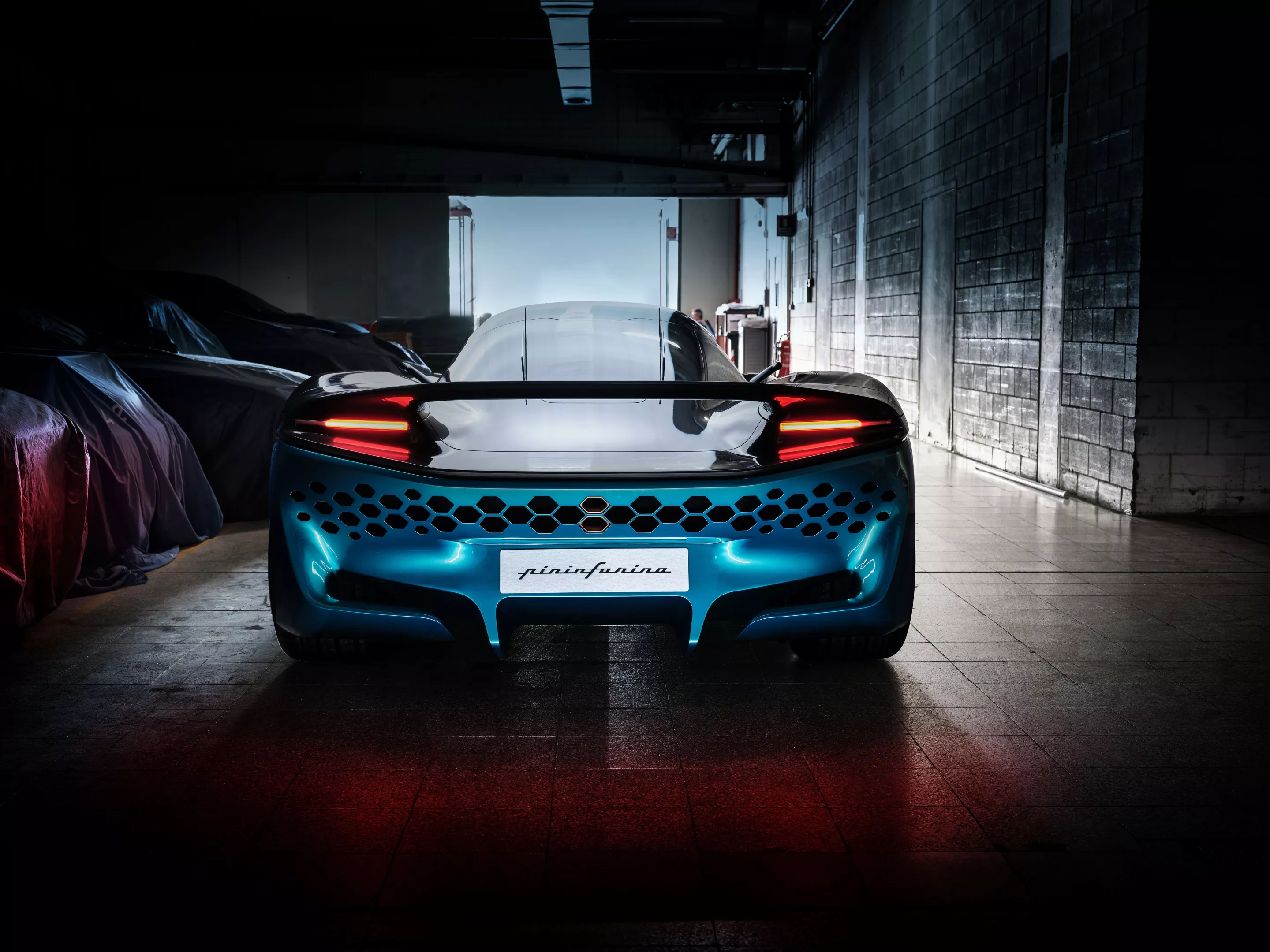 Without exhausts to build a tail around, Pininfarina went for this sexy honeycomb business