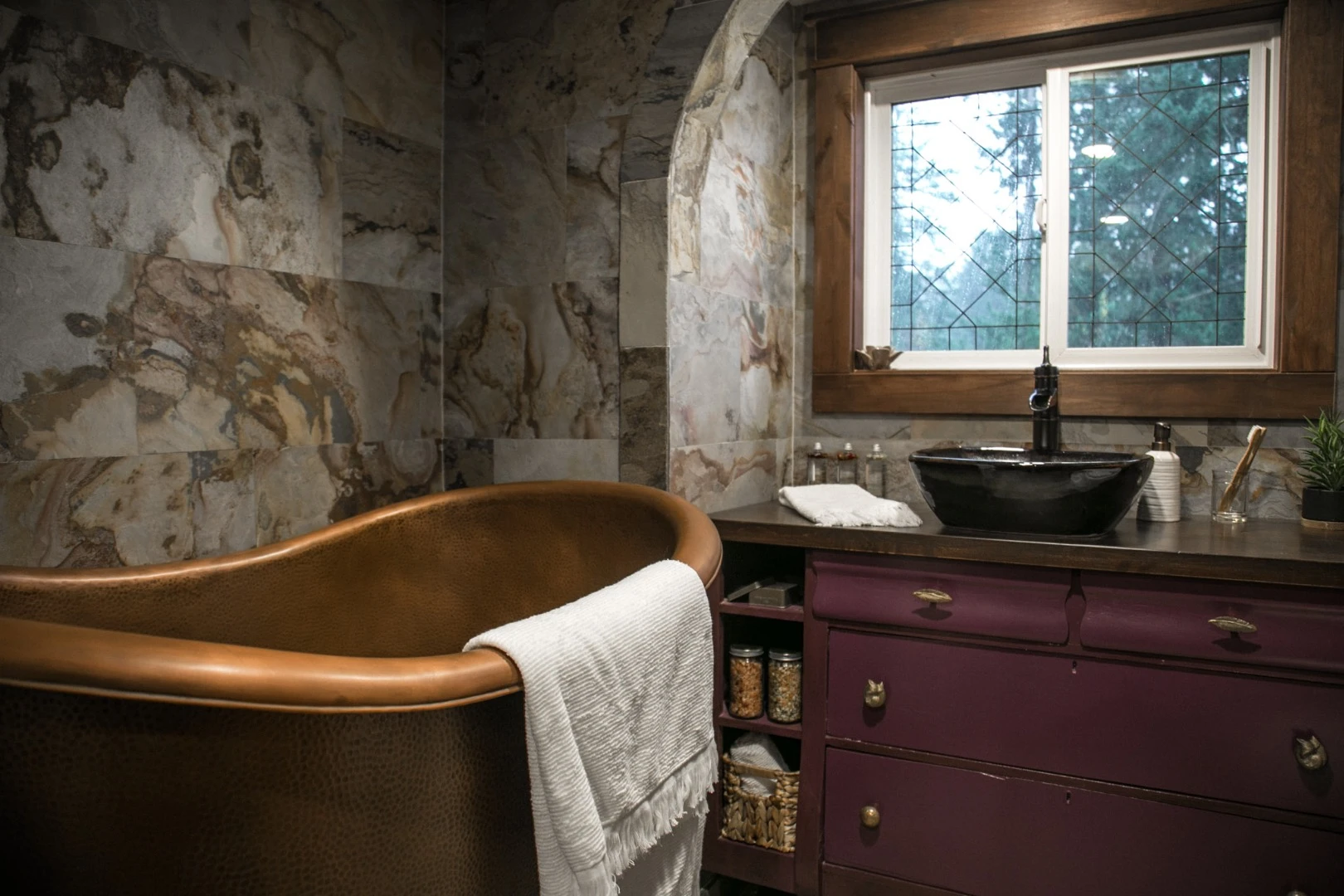 The Tudor-style tiny house's copper clawfoot bathtub