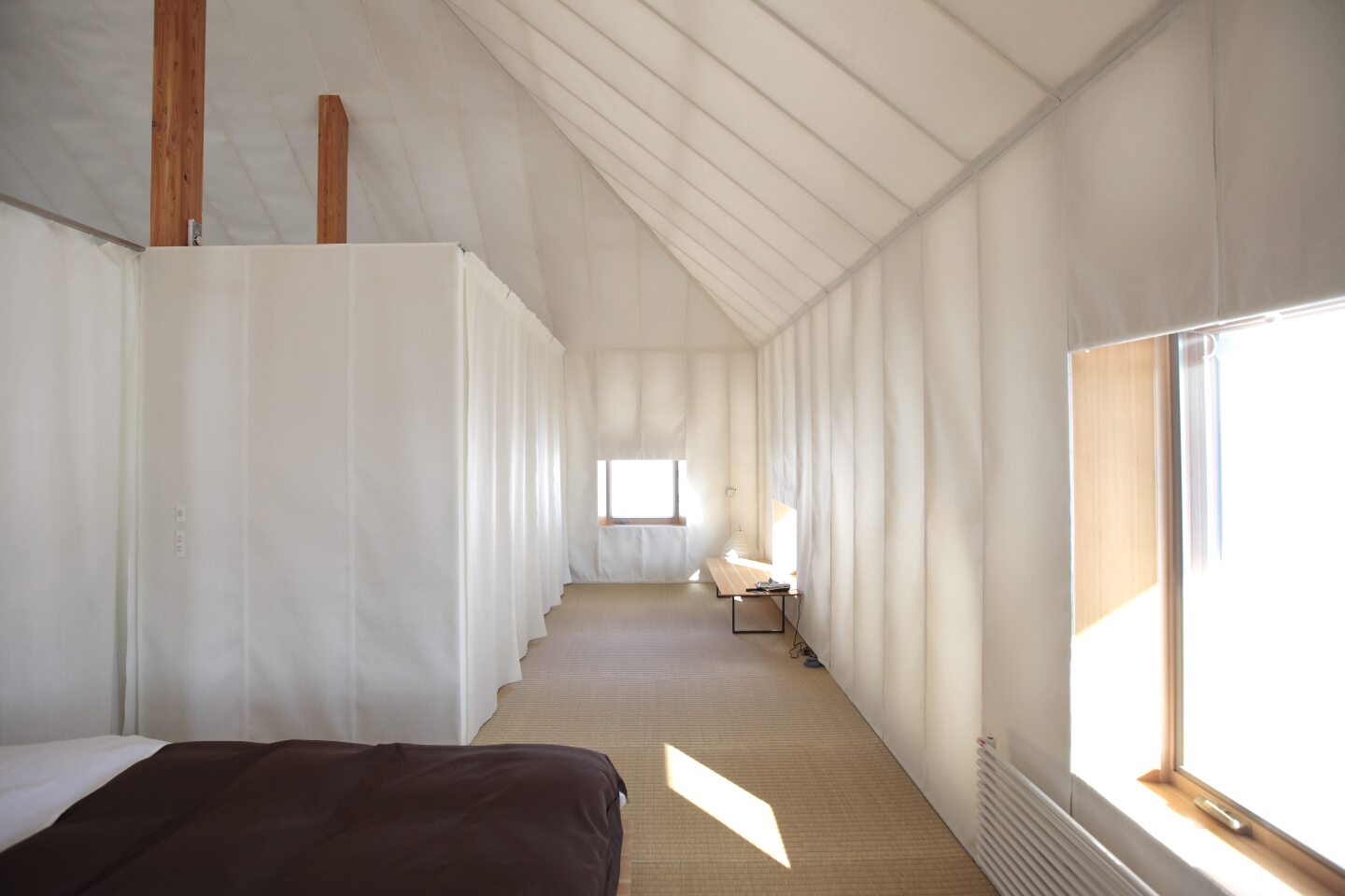 Fabric partitions create separate rooms (Photo: Kengo Kuma Associates, from the forthcoming book "Superlight")