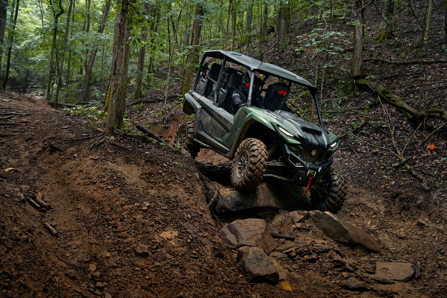 Working through slick, sloppy rock and dirt