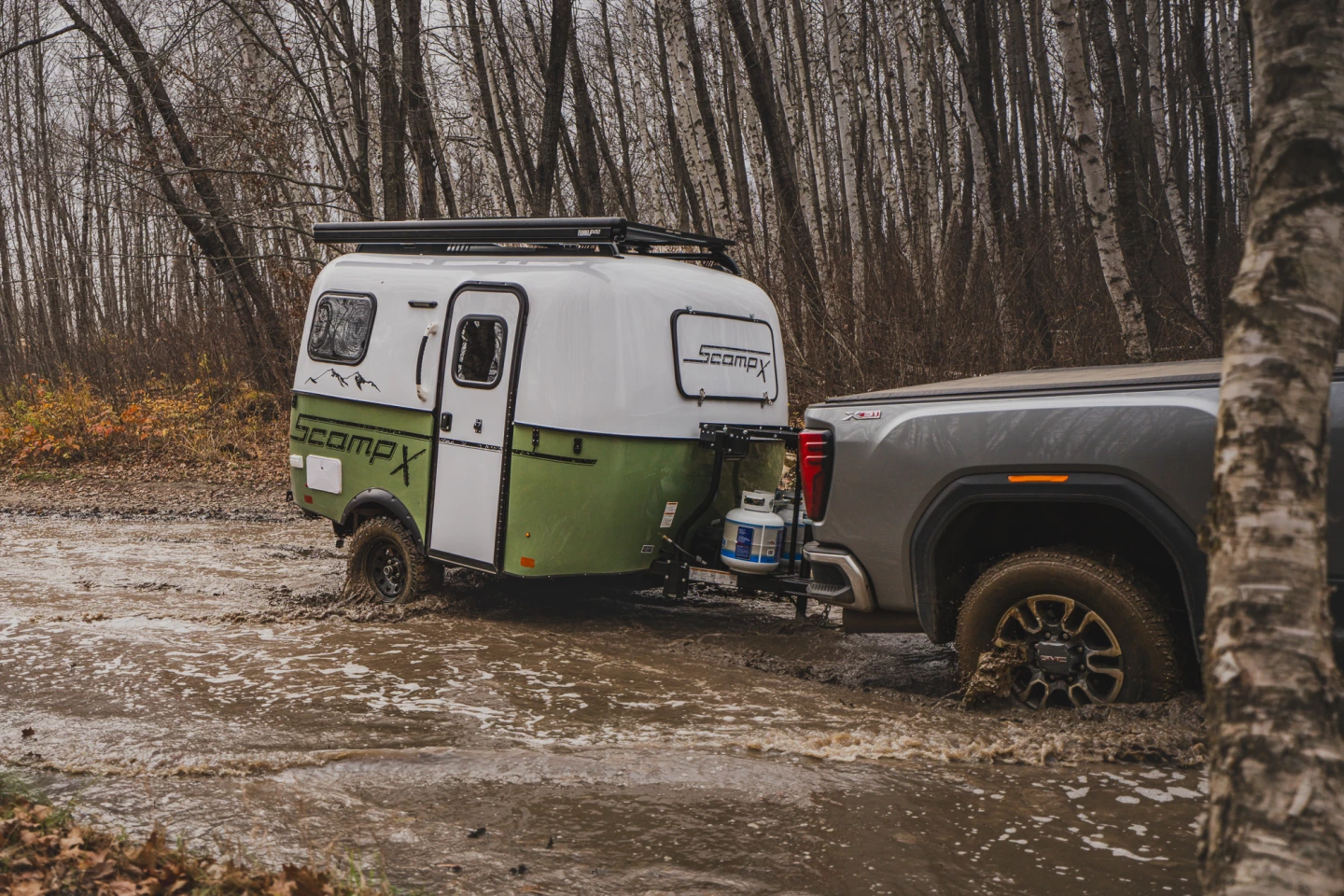 The Scamp X puts its increased ground clearance to work through absolute filth