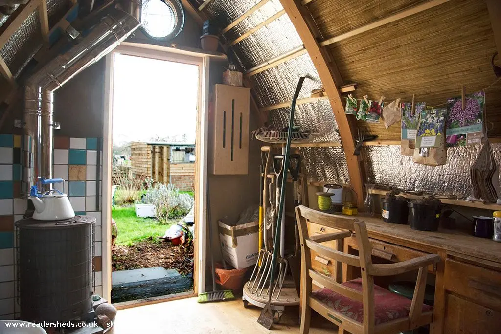 Shed of Dreams uses an unconventional roof construction, made by curving two members and then locking together to form a Gothic arch shape