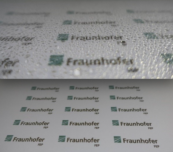 A sample of the new self-cleaning glass coating, showing its water repelling phase (top) and water-attr