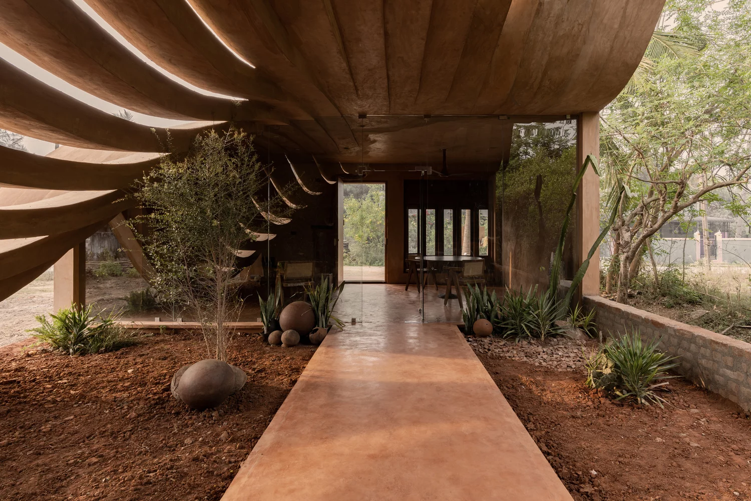 Floor-to-ceiling glass walls bring the outdoors inside