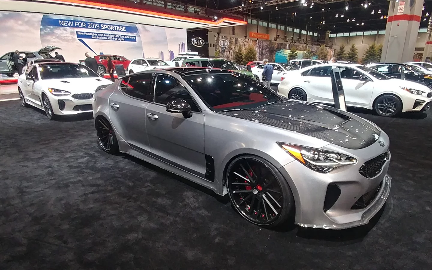 Kia's carbon fiber clad Stinger model, shown originally at CES, beckons sports car fans to the Kia floor space