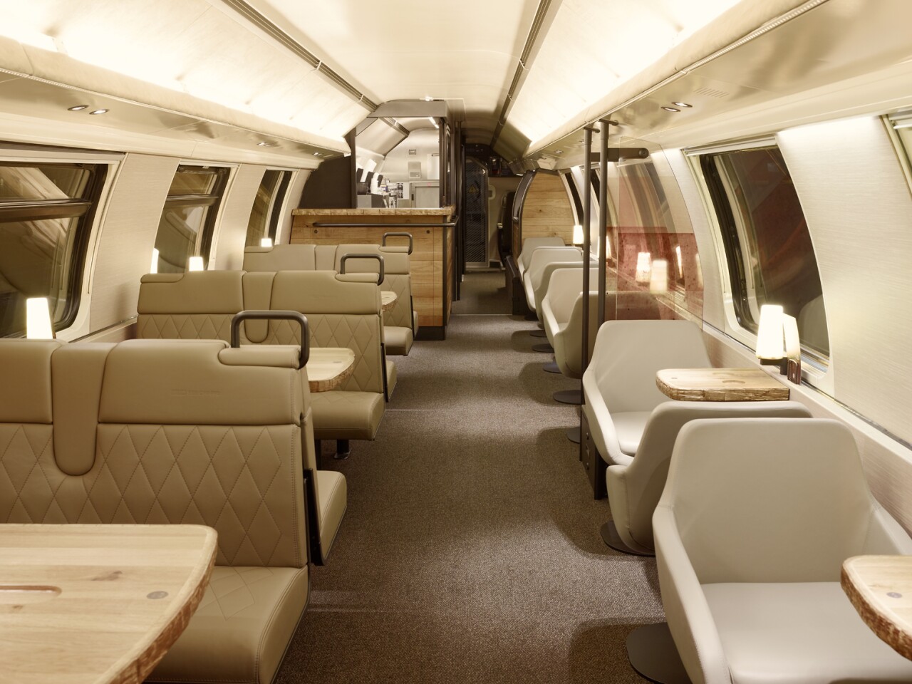 The chairs on the Starbucks carriage and covered in beige leather