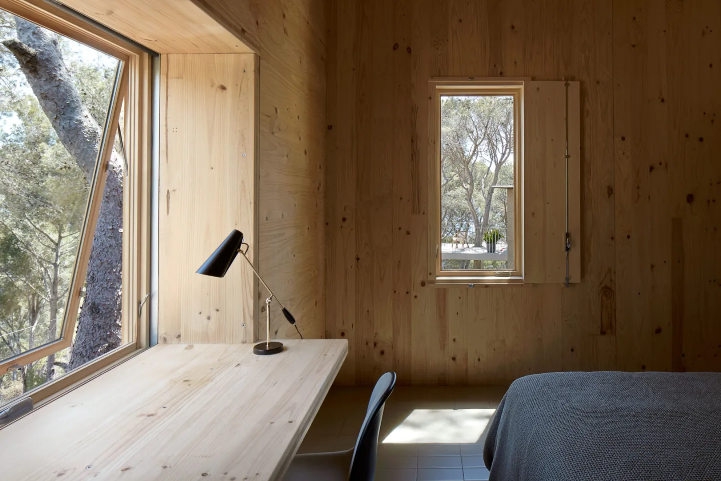 Where possible the homes also boast built-in timber furniture, including this desk in the bedroom