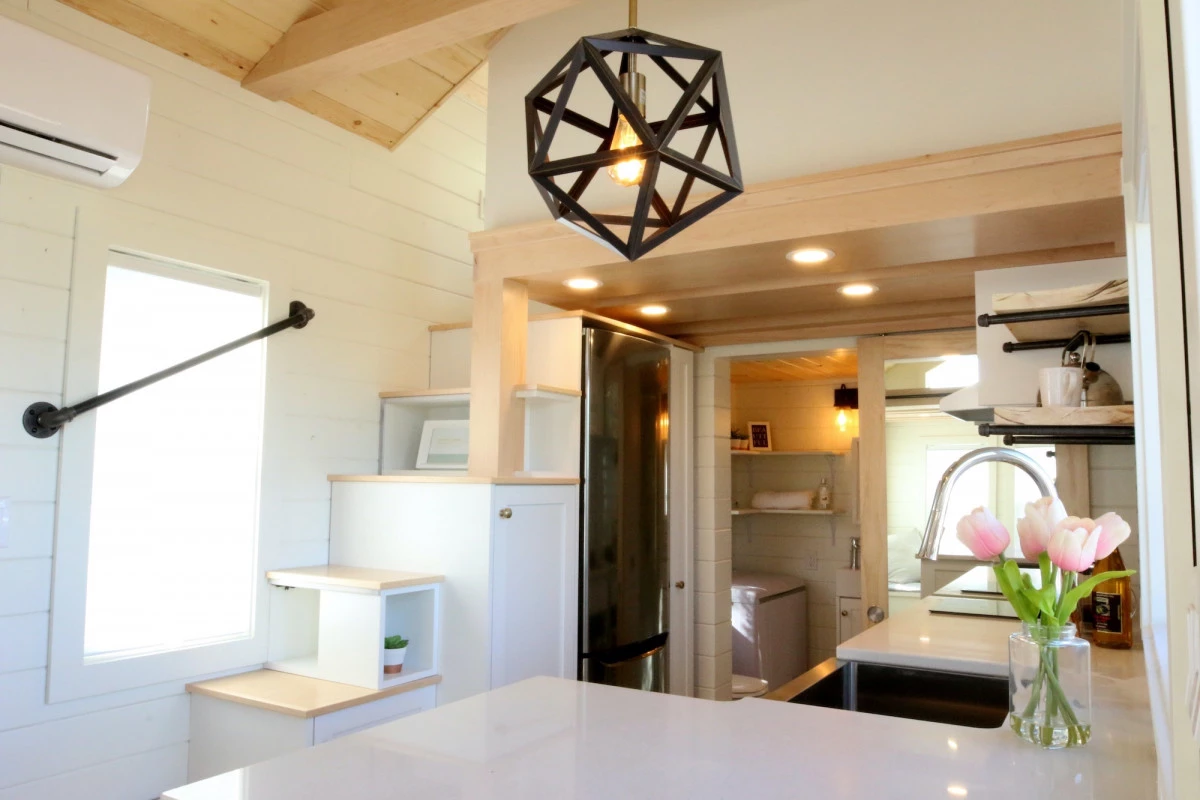 The Innisfree Anarres' main bedroom is reached by storage-integerated staircase