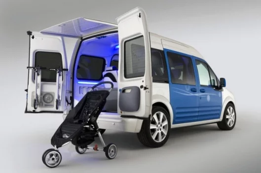 The fold-up stroller is contained within the floor of the vehicle