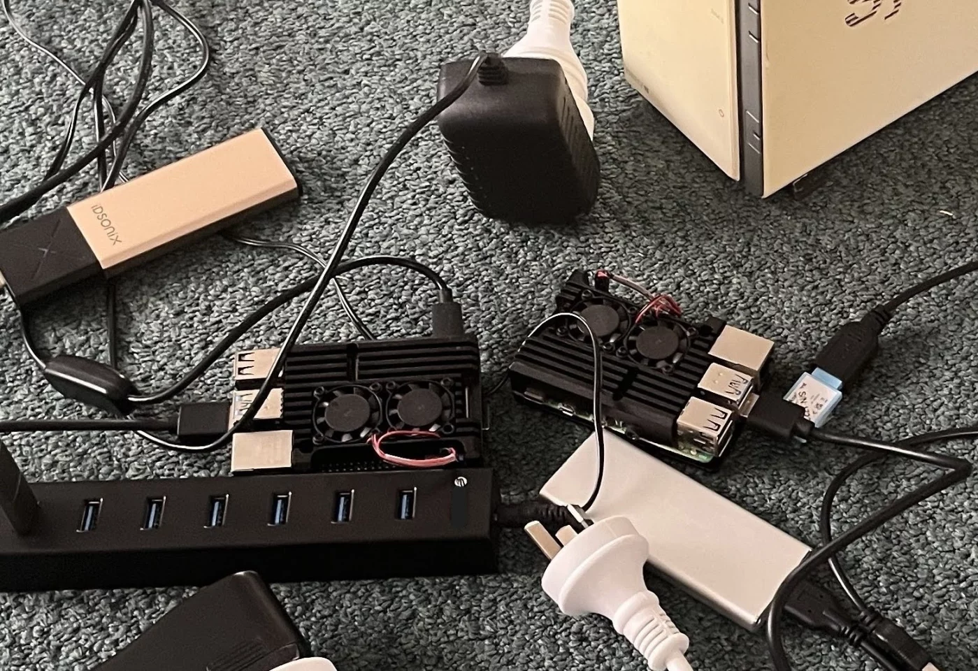 Homelab Mk1 circa 2014. Author's first attempt at digital sovereignty: one Raspberry Pi for Home Assistant, one for Plex, and a NAS full of music.