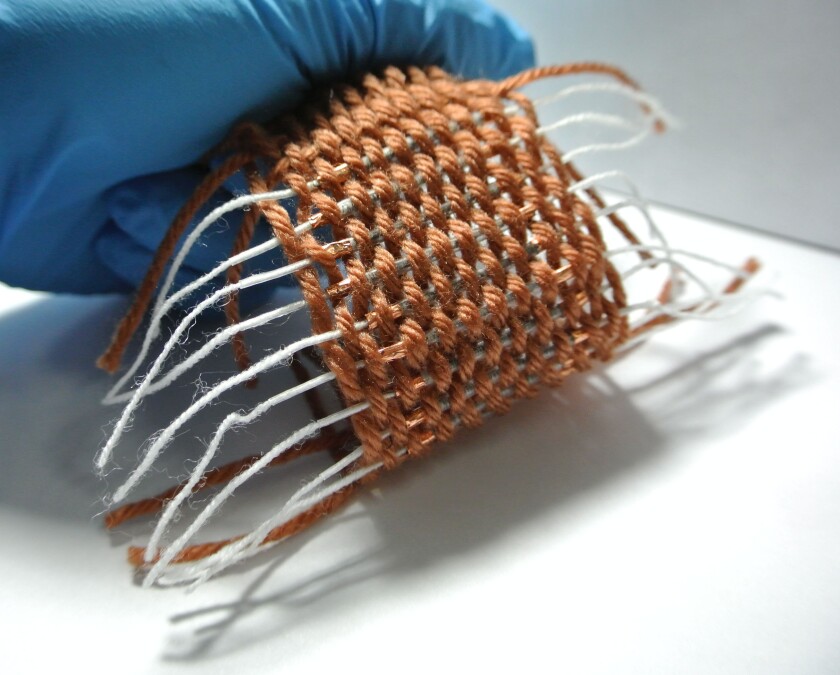 A 1 x 1 ft section of Li-ion battery yarn can deliver 6.8 Wh of power; enough power to run a mobile phone for a day (Photo: Wei Weng)