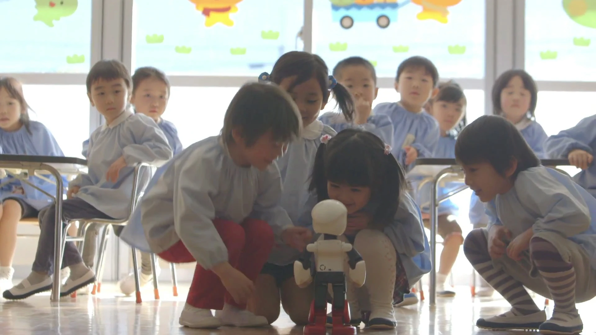 Children met with Kibo, a communication robot headed for the International Space Station later this year