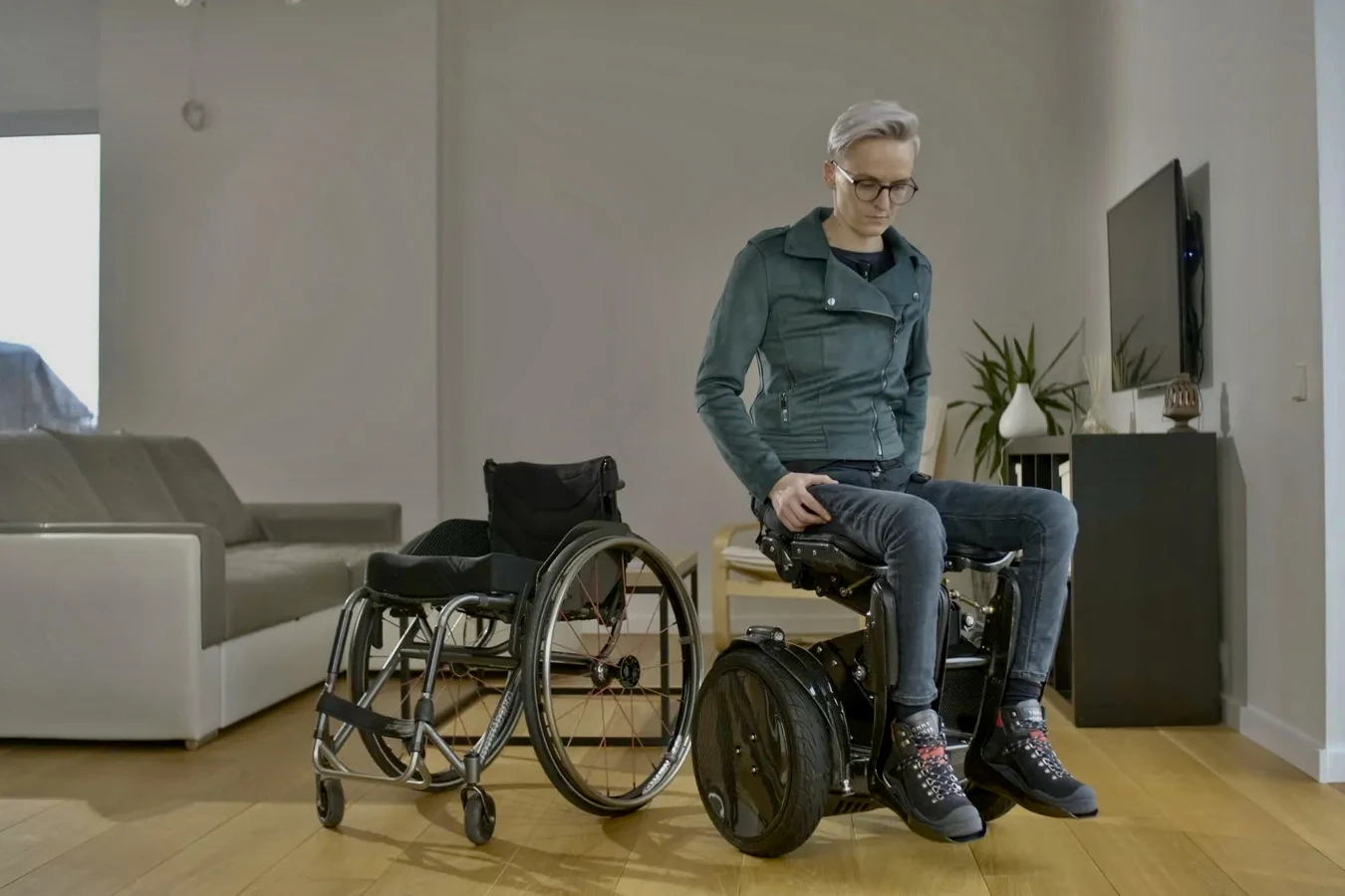 The Kim-e is claimed to be more compact than a traditional manual wheelchair (left) when folded