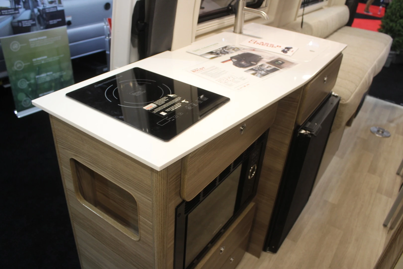 The Winnebago Boldt packs a fully equipped kitchen with induction cooktop, refrigerator and microwave