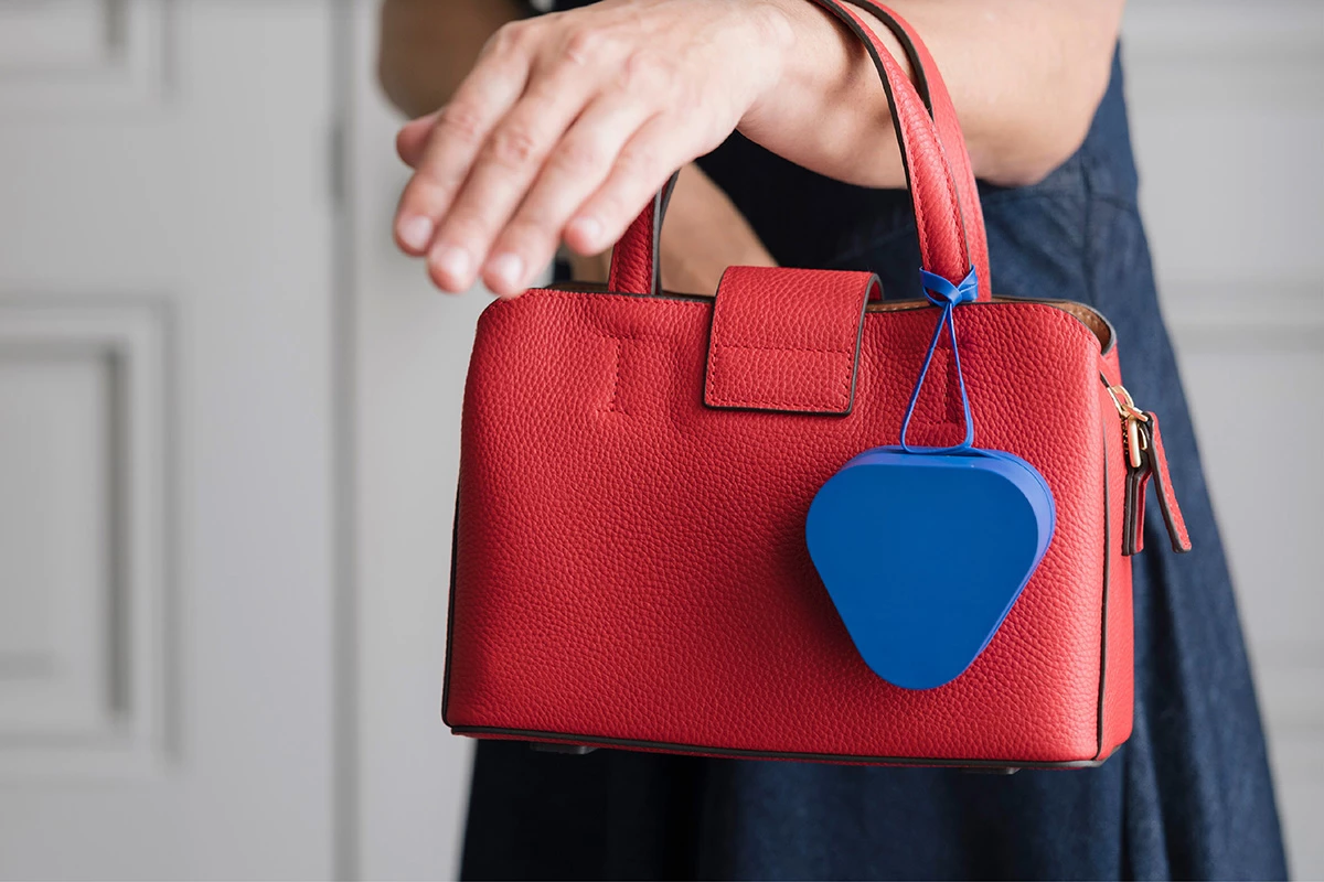 The included carrying handle can loop around bag and backpack straps when you're on the move