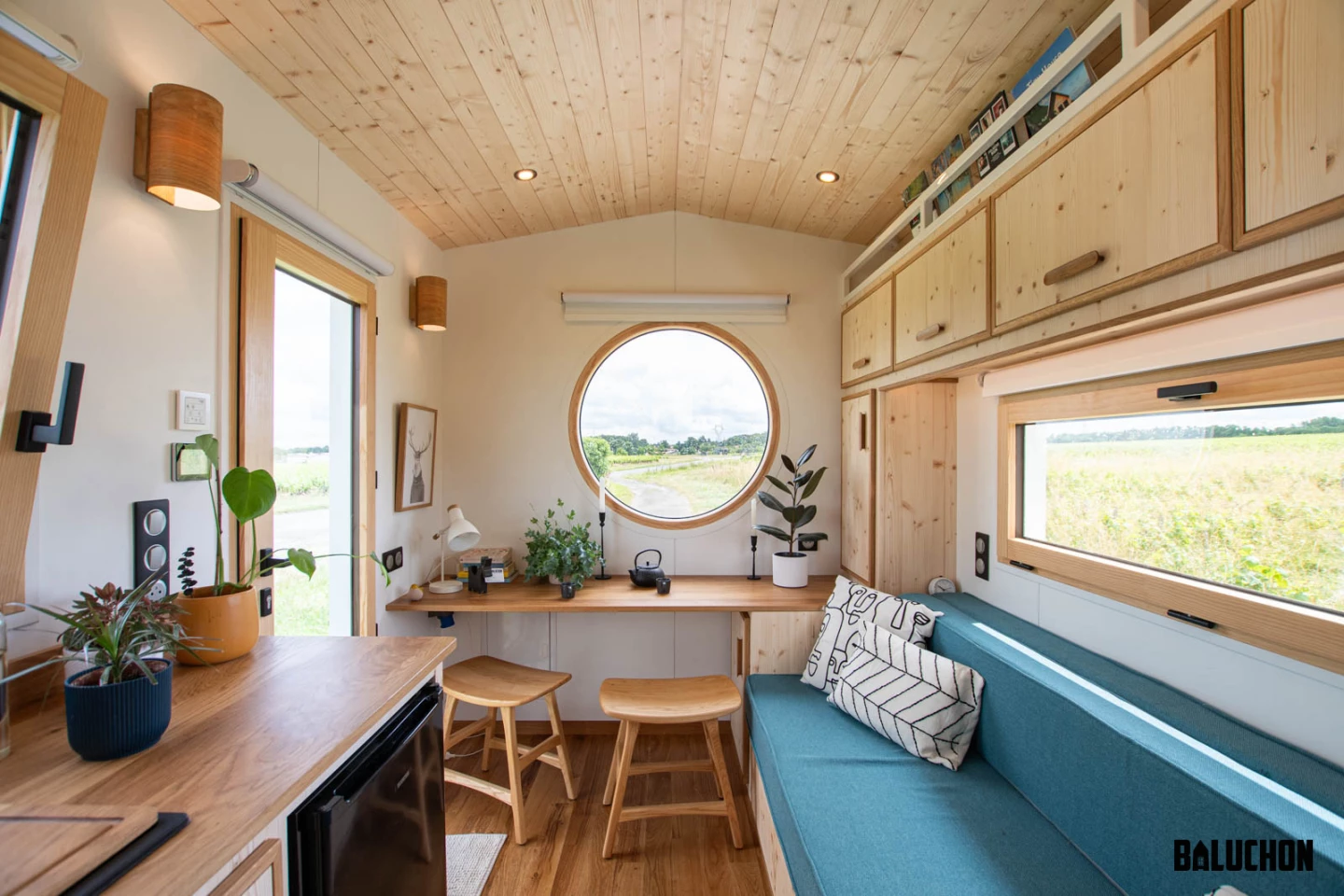 The Nano Suisse features generous glazing, including a large porthole-style window