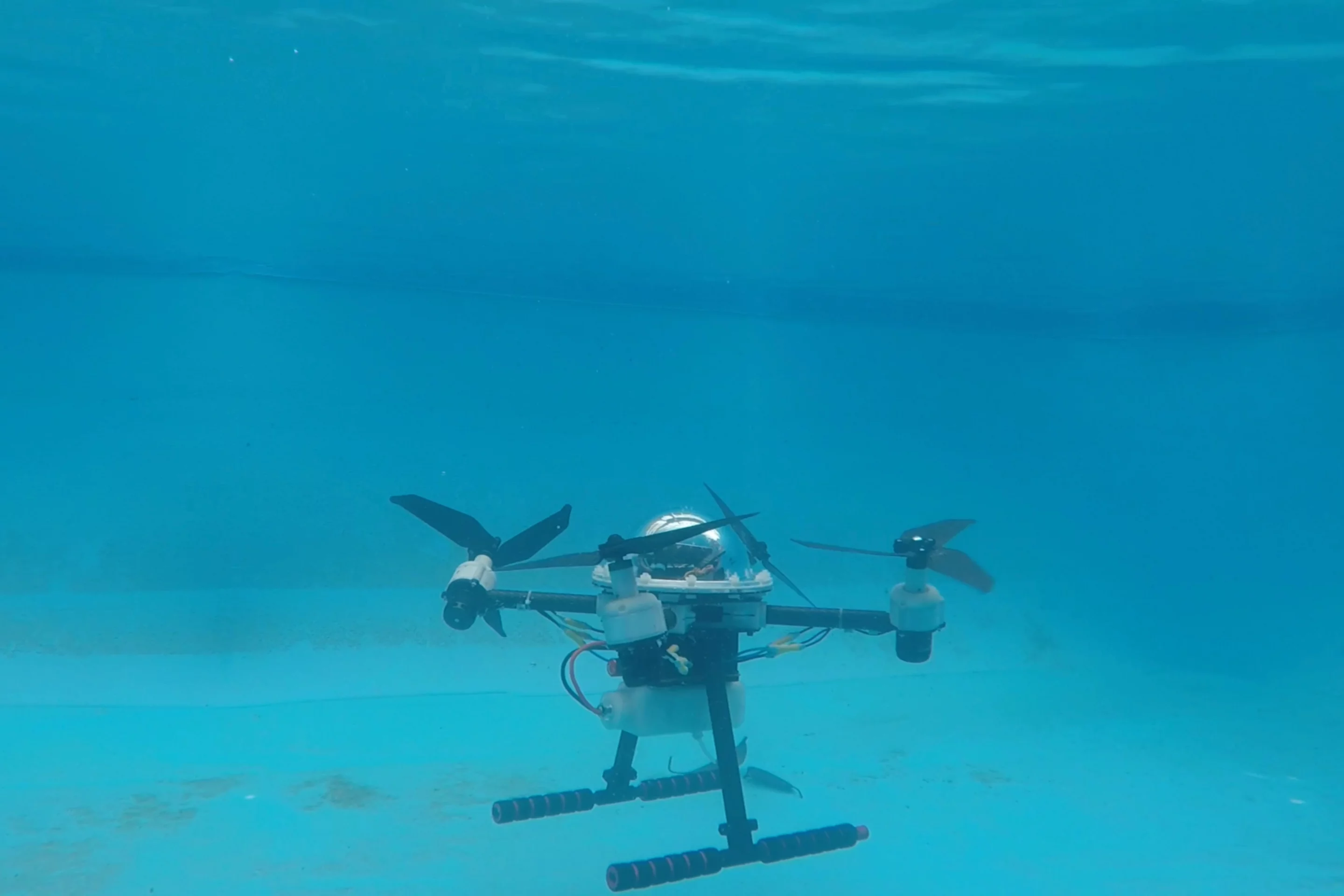 The TJ-FlyingFish is claimed to be lighter than other experimental aerial/aquatic drones, which simply add underwater hardware to a standard quadcopter body
