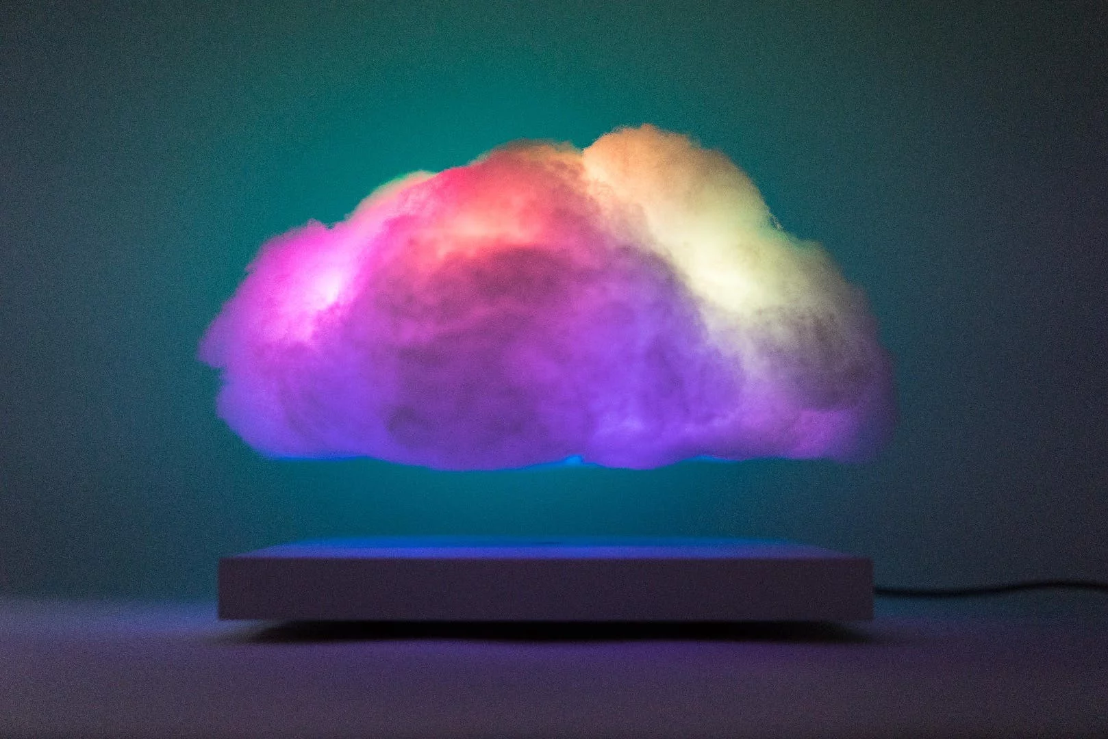 The Floating Cloud is a magnetically levitating ambient lamp that flickers through different colored LED modes in response to the sound in a room