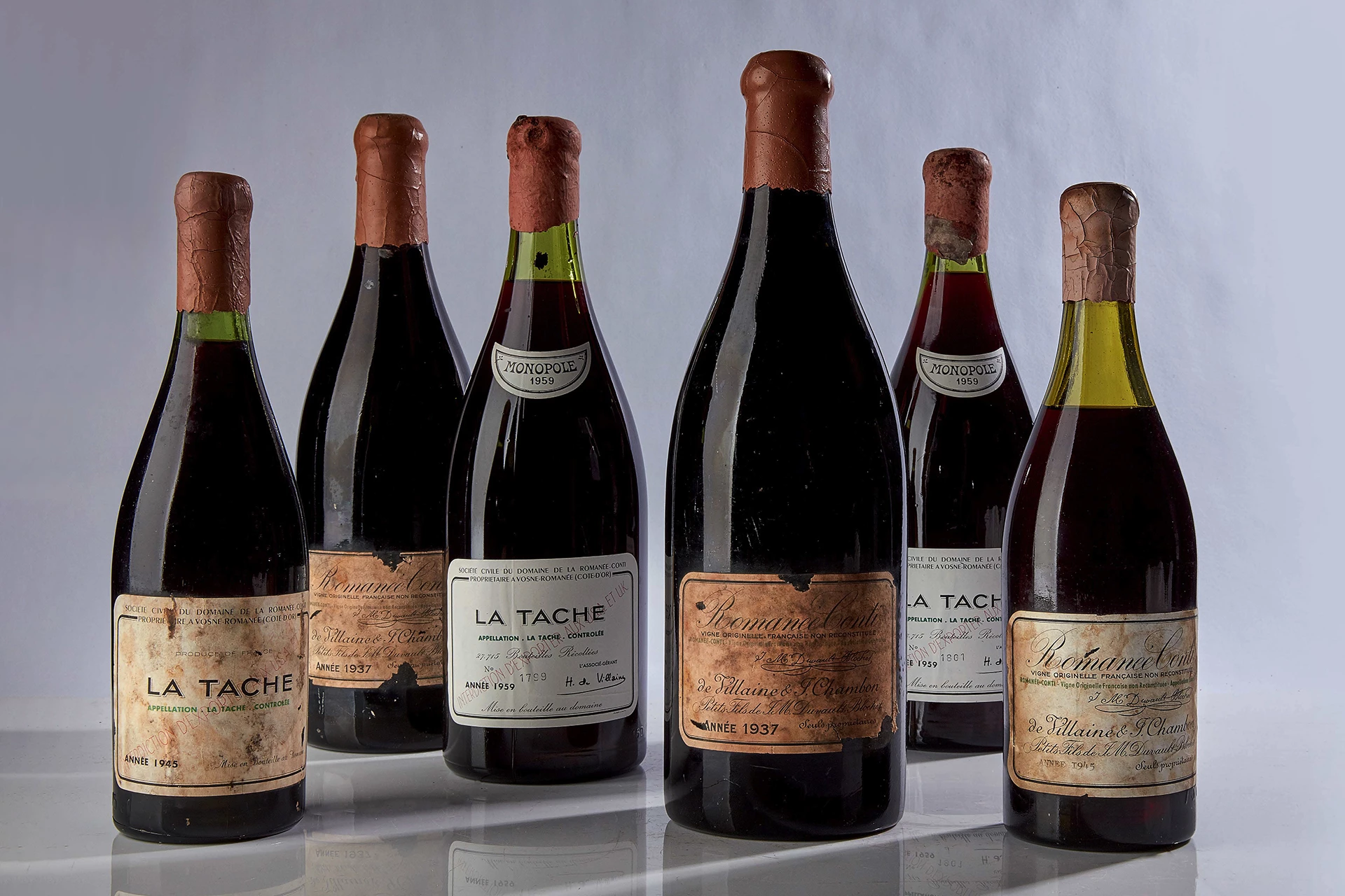 “The Extraordinary Wine Collection of Robert Drouhin” was auctioned on 13 October 2018 at Sotheby’s New York. Just a small selection of the wines sold that day, from left to right, are: La Tache 1945 Domaine De La Romanee-Conti ($297,600), Romanee Conti 1937 Domaine De La Romanee-Conti ($310,000), La Tache 1959 Domaine De La Romanee-Conti ($80,600), Romanee Conti 1937 Domaine De La Romanee-Conti ($310,000), La Tache 1959 Domaine De La Romanee-Conti ($80,600), Romanee Conti 1945 Domaine De La Romanee-Conti ($558,000). Three bottles of Romanee Conti 1937 Domaine De La Romanee-Conti actually sold for $310,000 each that day.