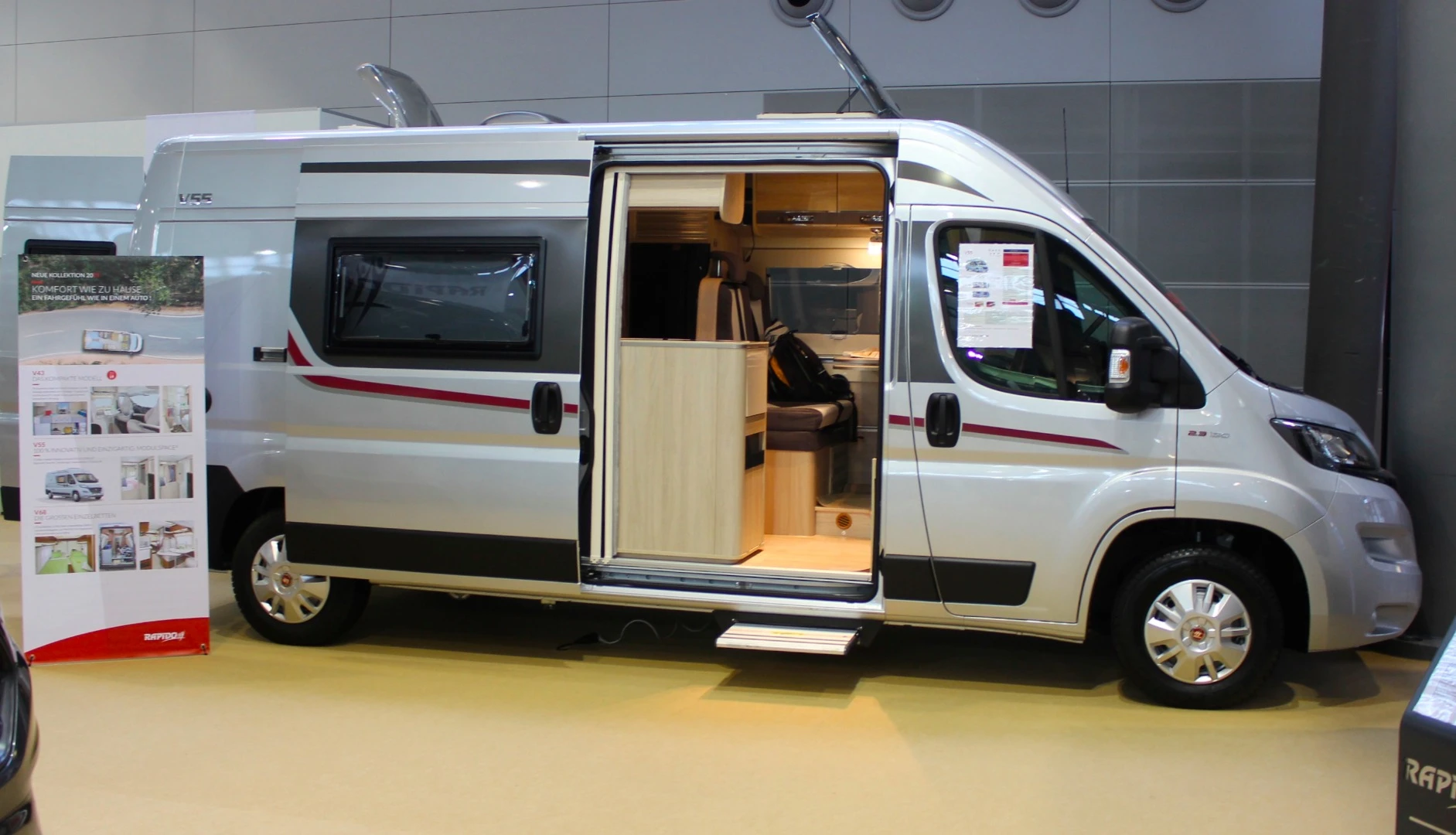 The 599 cm Rapido V55 uses some smart, space-optimizing design to sleep three people while offering a central dry bath layout with separate shower and toilet rooms