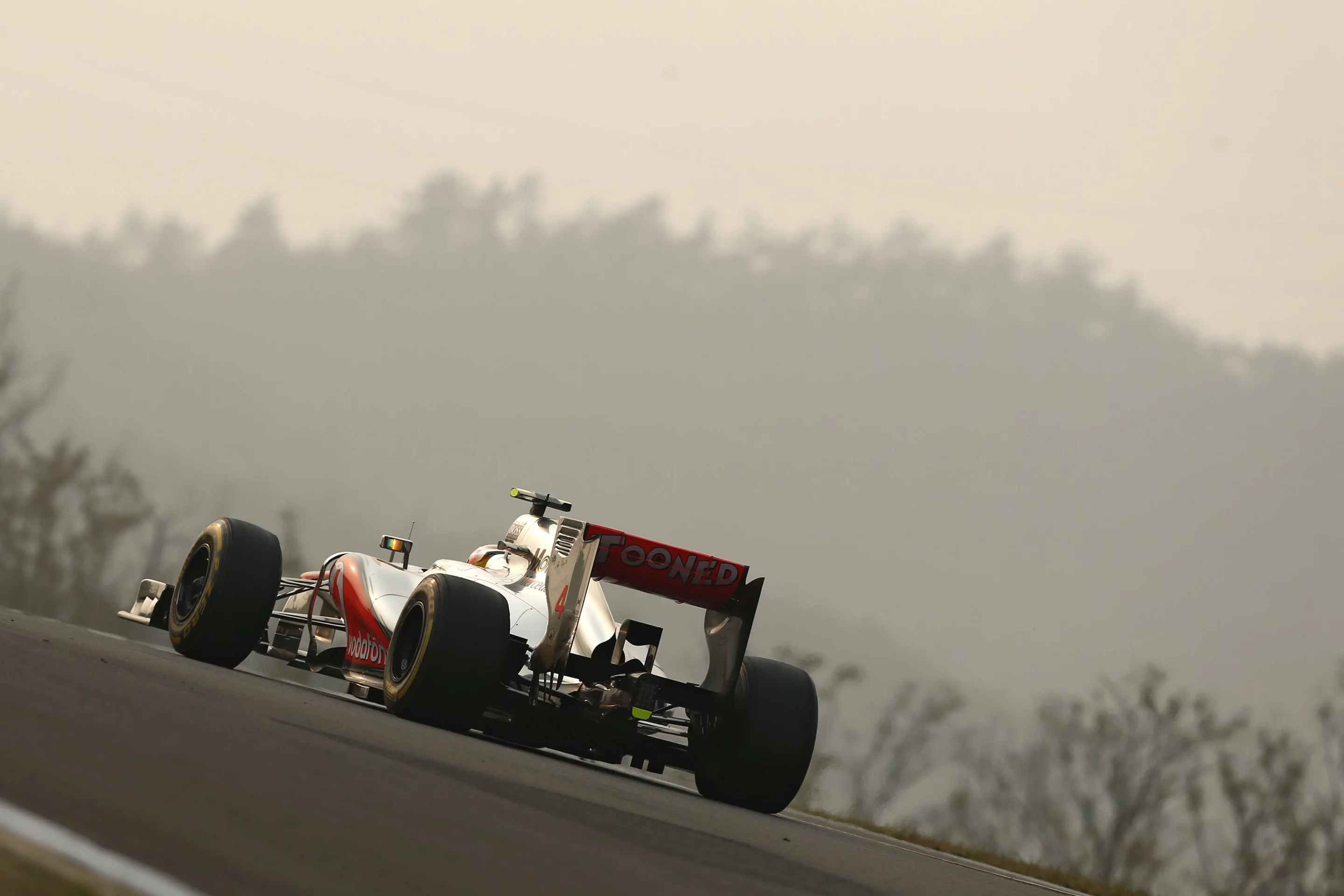Vertical wing panels show side venting, part of McLaren's F-duct system that causes the rear wing to lose drag during straight line runs