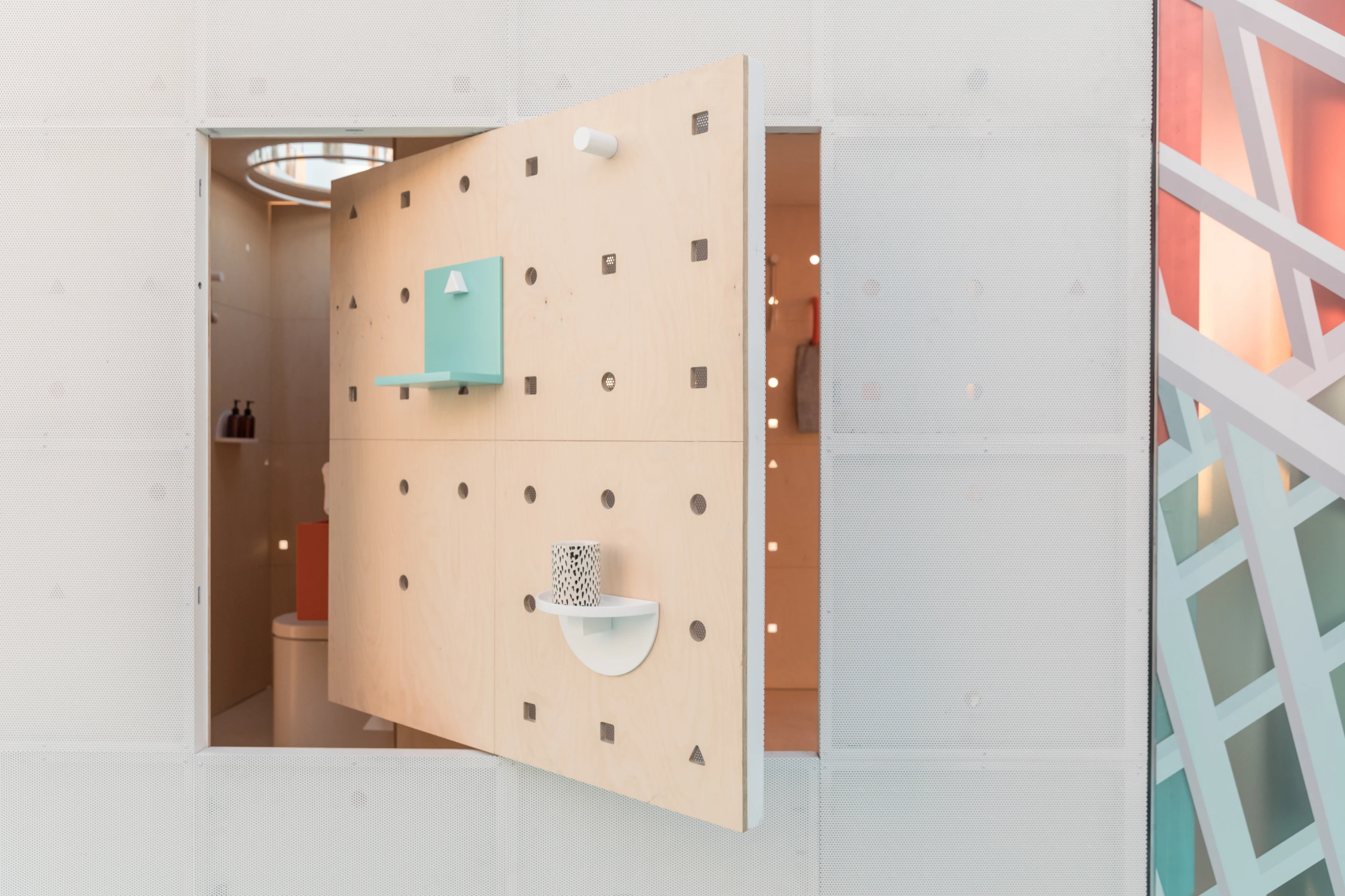 Space-saving mechanisms like folding dining tables and shelves and rotating panels feature throughout Mini's urban cabin concept in LA
