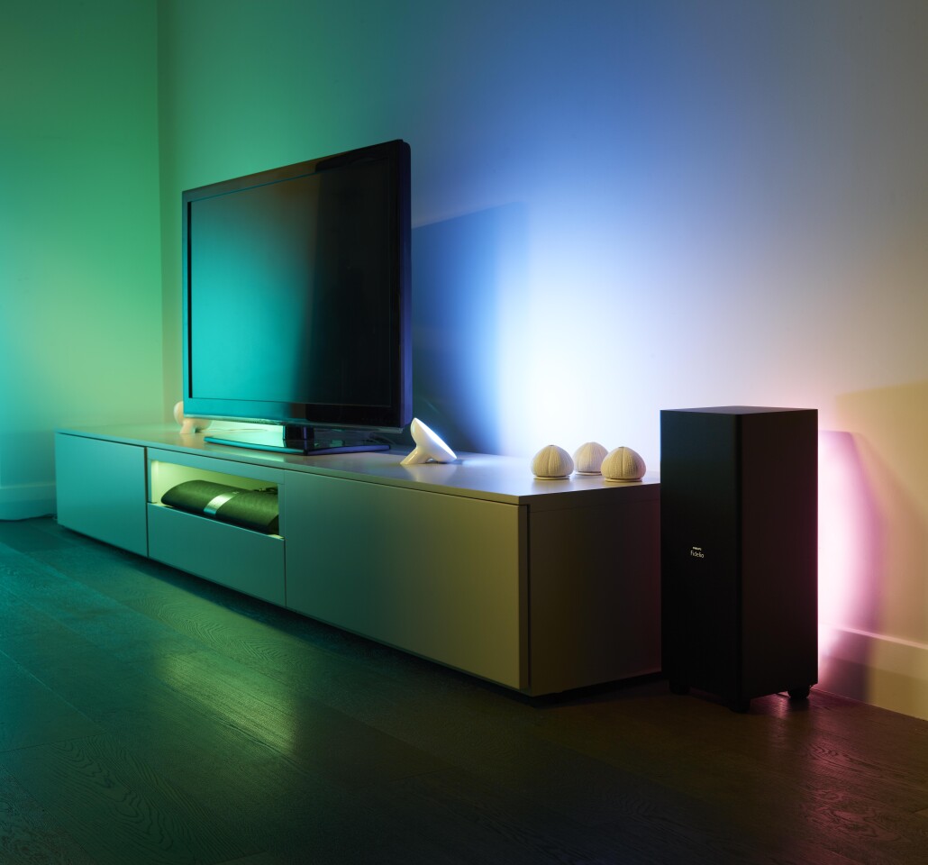 A pair of Philips' LivingColors Bloom would probably make quite a good alternative to Ambilight