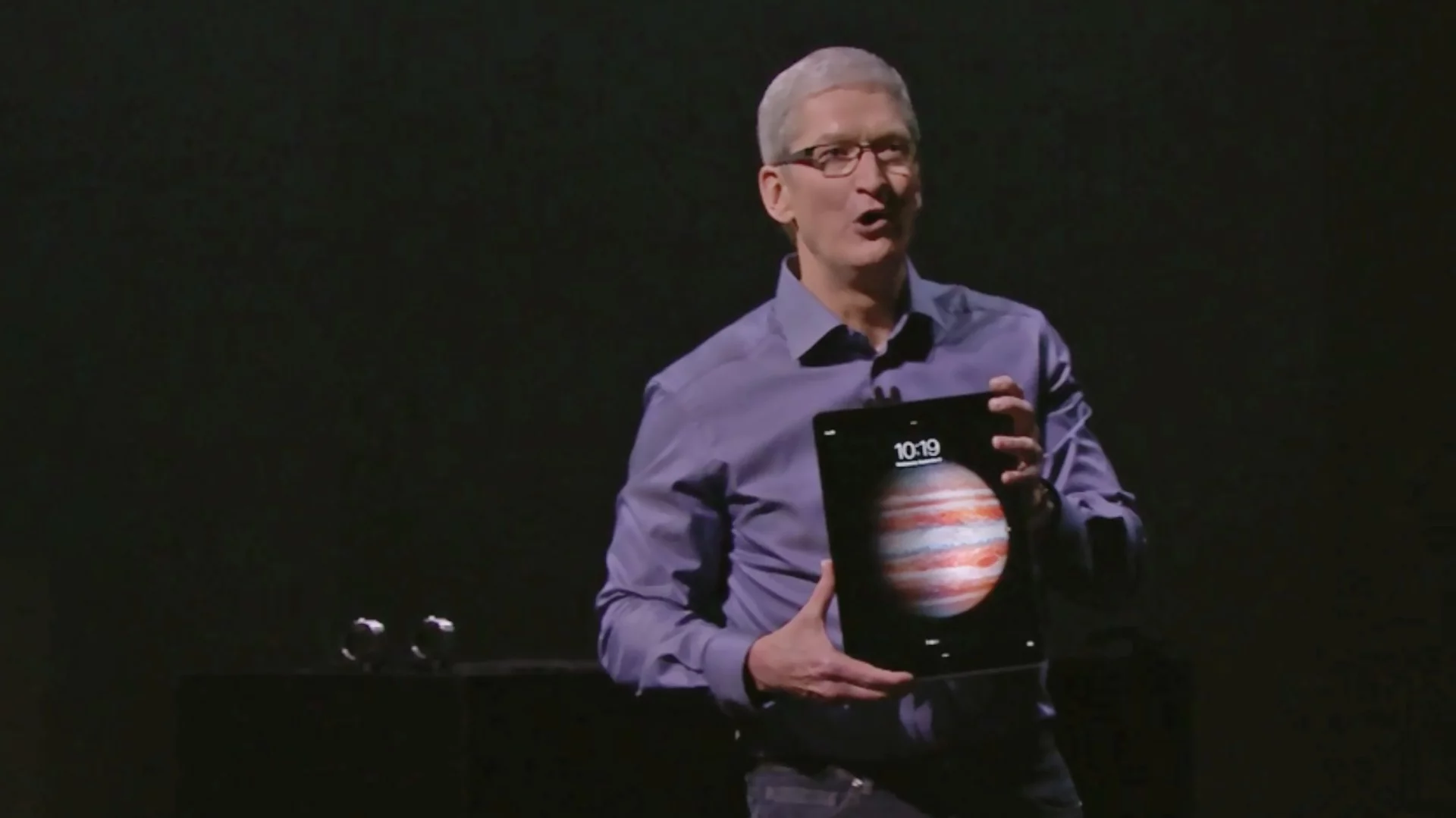 Apple CEO Tim Cook holding the huge iPad Pro