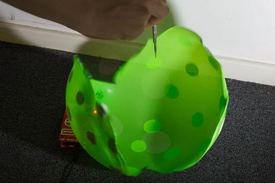 The Triggertrap is triggering a couple of Canon 580 EX II flashes when it registers the sound of the balloon's pop - second image