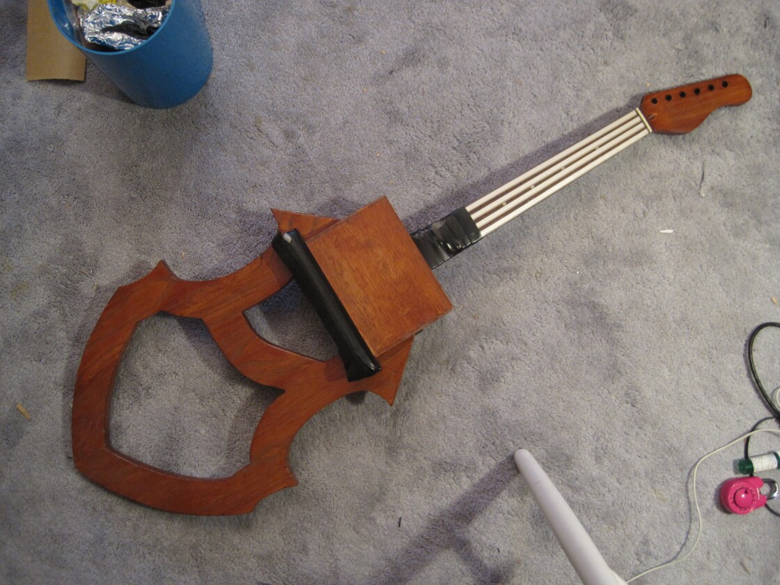 Early prototype of the Magnetic Cello, with four resistive ribbons on the neck