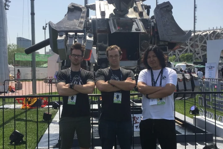 MegaBots co-founders Matt Oehrlein and Gui Cavalcanti with Monkey King creator Shiqian Sun