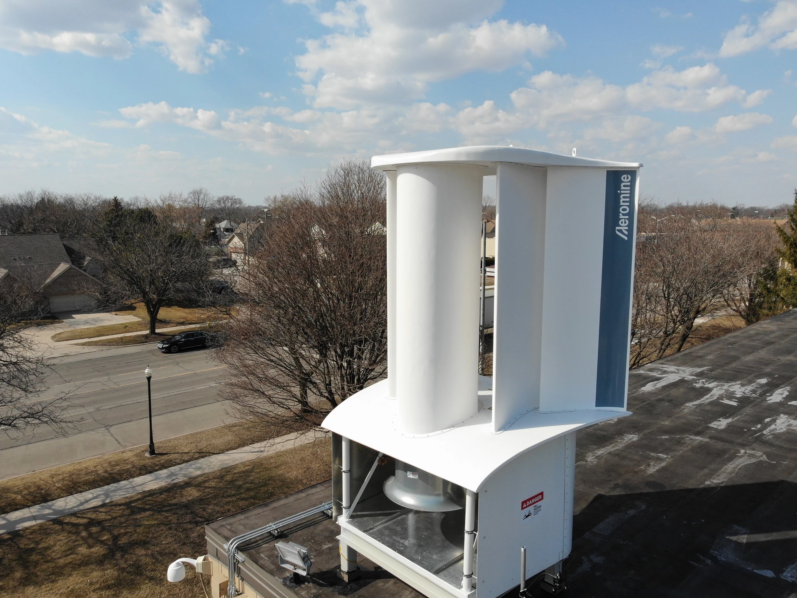 Aeromine Wind-Harvesting Unit, installed as a pilot trial on top of BASF's manufacturing facilities in Wyandotte, Michigan. We expect the large box at the bottom will disappear in commercial applications, with the air intake and turbine running below the roof line