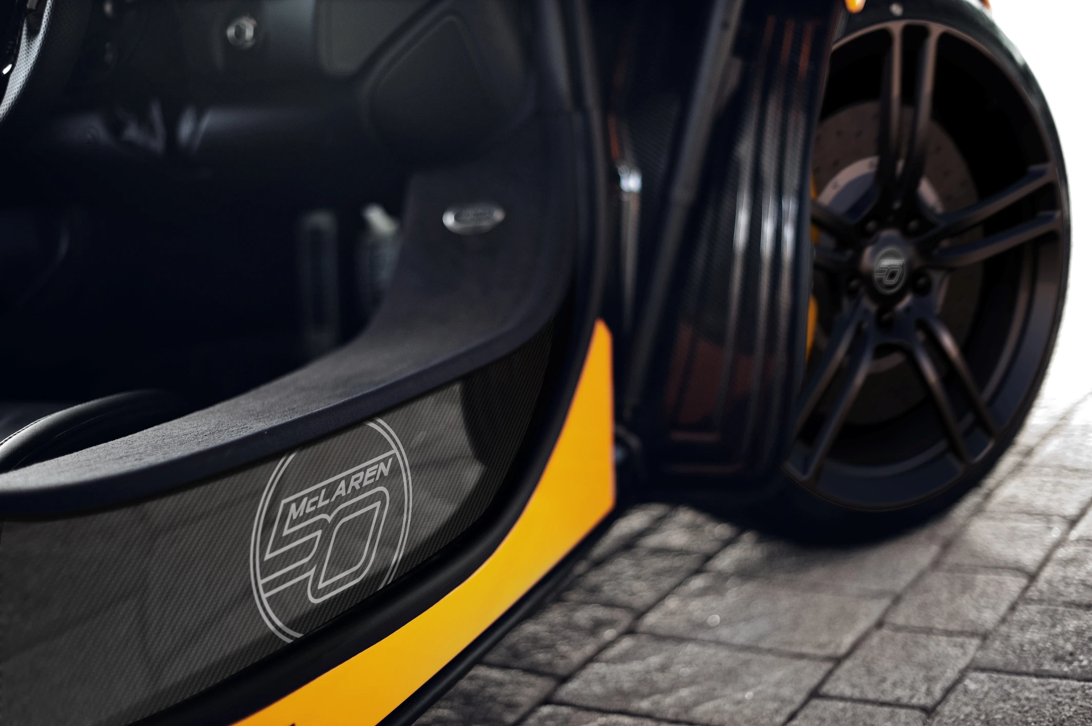 Carbon ceramic brake upgrade and satin black ultra-lightweight wheels enhance the visuals while reducing unsprung weight by 4.4 pounds