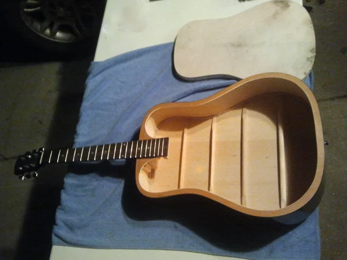 The donor guitar had its soundboard removed, and structural changes were made to the inside