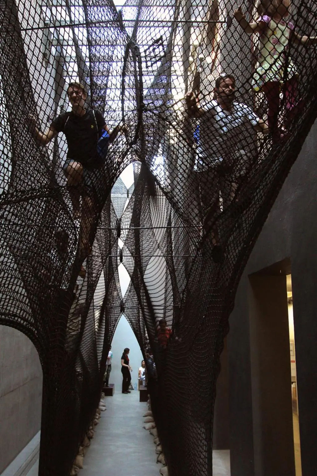 People are asked to remove their shoes before climbing Net Linz