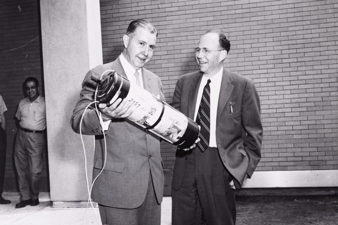 President James R. Killian Jr (left) and professor of electrical engineering Harold “Doc” Edgerton burying the time capsule